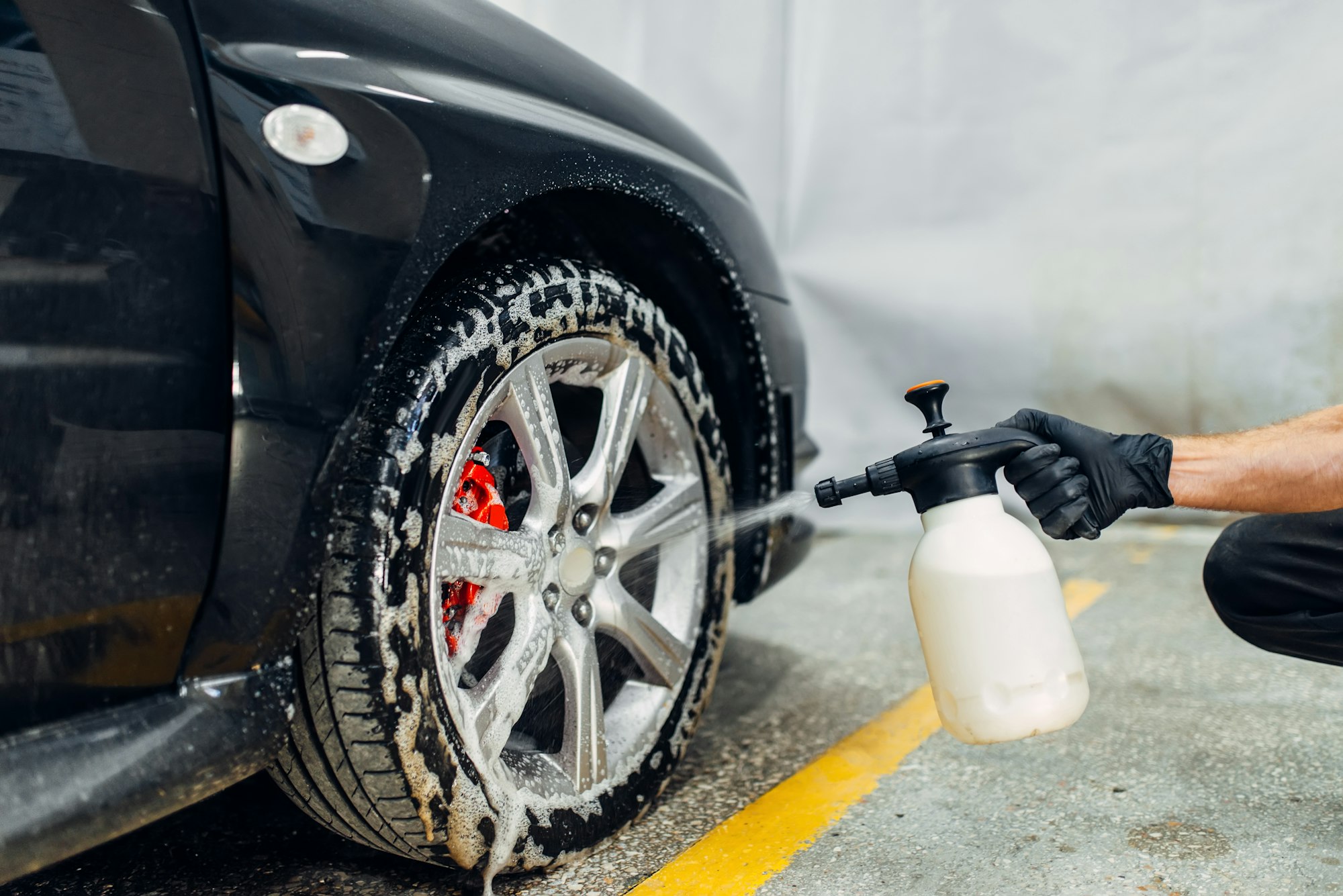 Carwash, cleaning the wheels with a special agent